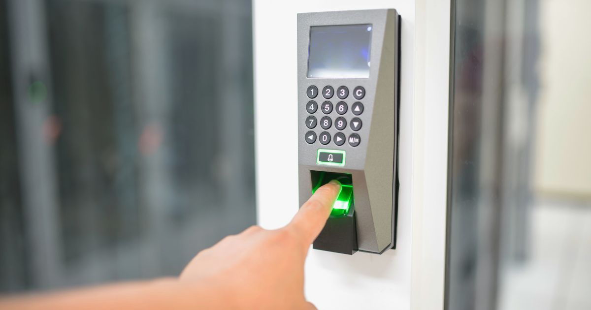Door Access Control (Person using a fingerprint biometric door access control reader with keypad) Door Access Control (Person using a fingerprint biometric door access control reader with keypad)